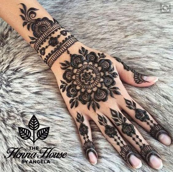 2. Black Full Hand Mehndi Design: